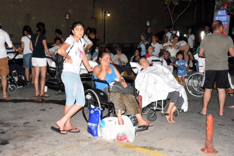 People wait in front of a hospital after an earthquake in the resort town of Bodrum in Mugla province, Turkey, July 21, 2017. Dogan News Agency via REUTERS