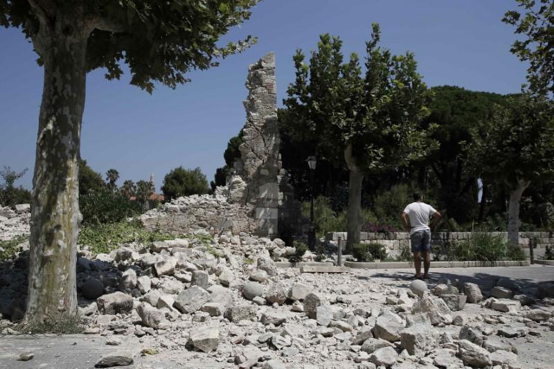 A man stands next to debris following an earthquake on the island of Kos, Greece on July 21, 2017. (REUTERS/Costas Baltas)