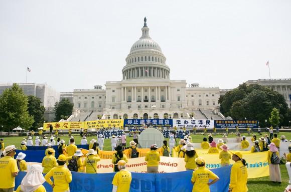 Members of Falun Gong protest their persecution in China at a rally in front of the nation's capital on July 20, which date is the 18th anniversary of when communist China banned the practice. They hope to elicit the support of the U.S. Congress. (Lisa Fan/ Epoch Times)