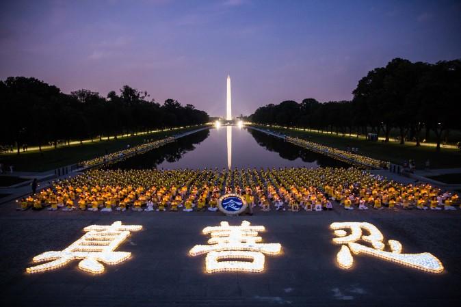 Hundreds of Falun Dafa practitioners hold a candlelight vigil in Washington on July 20, 2017 to remember the victims of the Chinese regime's persecution of the practice that began on July 20, 1999. The candles in the front form the Chinese characters for truthfulness, compassion, and tolerance, the three main tenets of Falun Dafa. (Benjamin Chasteen/The Epoch Times)