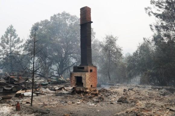 A chimney stands amidst remains of a home destroyed by the Detwiler fire in Mariposa, California. (Reuters/Stephen Lam)