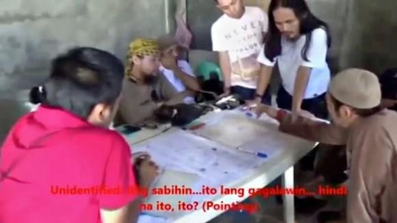 File photo: Men identified by Philippines Intelligence officers as Isnilon Hapilon (2nd L, yellow headscarf) and Abdullah Maute (2nd R, standing, long hair) are seen in this still image taken from video released by the Armed Forces of the Philippines on June 7, 2017. (Armed Forces of the Philippines/Handout via Reuters TV)
