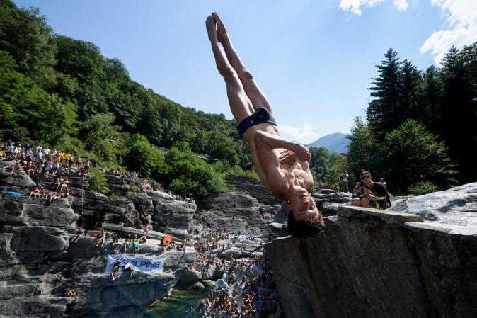 British diver Aidan Heslop competes during the International Cliff Diving Championship in Ponte Brolla, southern Switzerland, on July 22, 2017. Surrounded by steep granite cliffs, the canyon of Ponte Brolla is one of the world's most spectacular natural settings for cliff diving. (FABRICE COFFRINI/AFP/Getty Images)