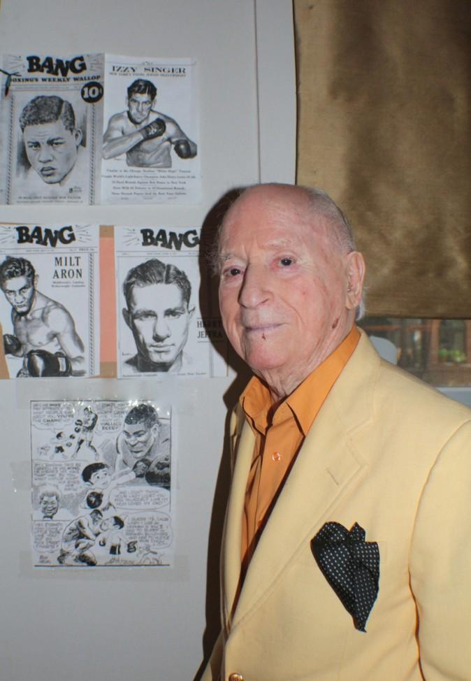 Irwin Hasen poses with some of the covers he drew of famous prize fighters for Bang Magazine. (Myriam Moran copyright 2014)