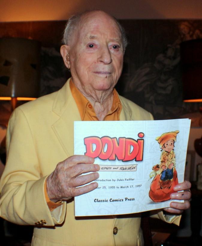 Irwin Hasen with his book, one of two volumes, published about the Dondi strip that ran for 34 years in newspapers across America. (Myriam Moran copyright 2014)