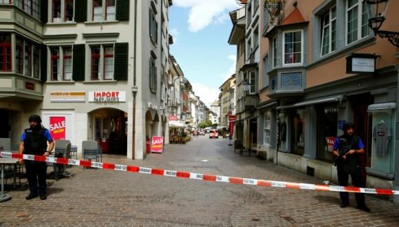 Swiss police officers stand at a crime scene in Schaffhausen, Switzerland July 24, 2017. (Arnd Wiegmann/Reuters)