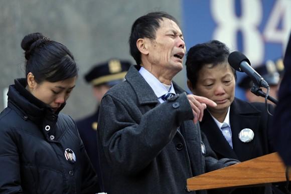 Wei Tang Liu (C), the father of Detective Wenjian Liu, speaks during a plaque dedication ceremony for two fallen New York Police Department officers, Detective Rafael Ramos and his partner Detective Wenjian Liu at the 84th Precinct in Brooklyn on Dec. 20, 2015 in New York City. Detectives Ramos and Liu were fatally shot while sitting in their patrol car in Bedford-Stuyvesant one-year ago. The gunman, Ismaaiyl Brinsley, then killed himself. (Spencer Platt/Getty Images)