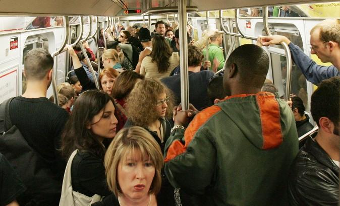 Subway passengers ride a crowded L train in New York City. (Mario Tama/Getty Images)