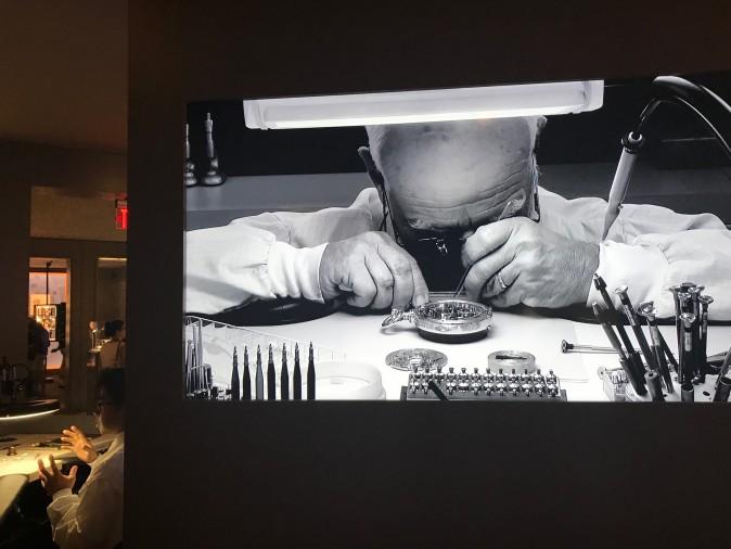 A video of master watchmaker Paul Buclin is shown in the watchmakers room of "The Art of Watches Grand Exhibition" of Patek Philippe in New York on July 21, 2017. (Milene Fernandez/The Epoch Times)
