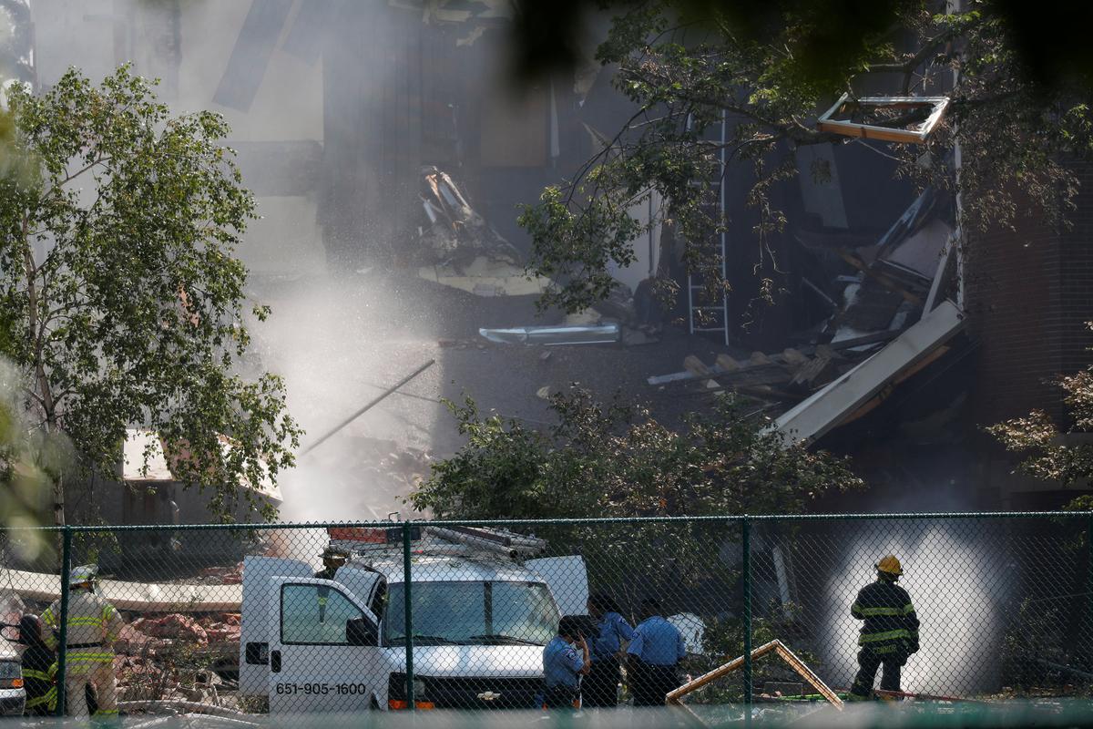 Emergency personnel put water on the scene of school building explosion and collapse at Minnehaha Academy in Minneapolis, Minnesota, U.S., August 2, 2017. REUTERS/Adam Bettcher