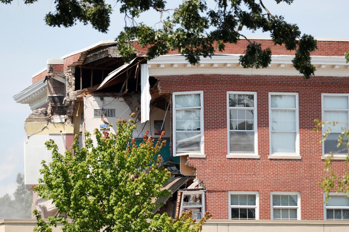 Damage to the building is seen as emergency personnel work the scene of school building collapse at Minnehaha Academy in Minneapolis, Minnesota on Aug. 2, 2017. (REUTERS/Adam Bettcher)