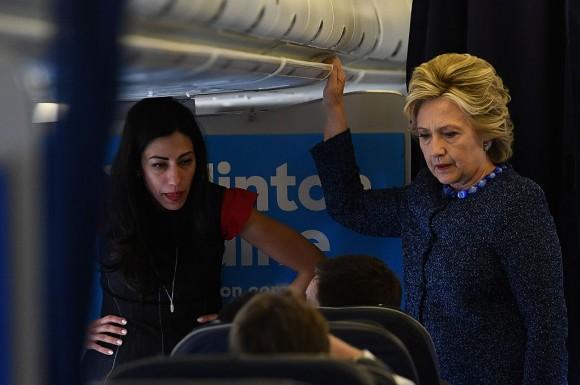 U.S. Democratic presidential nominee Hillary Clinton with aide Huma Abedin (L) onboard their campaign plane at the Westchester County Airport in White Plains, N.Y., on Oct. 28, 2016. (Jewel Samad/AFP/Getty Images)
