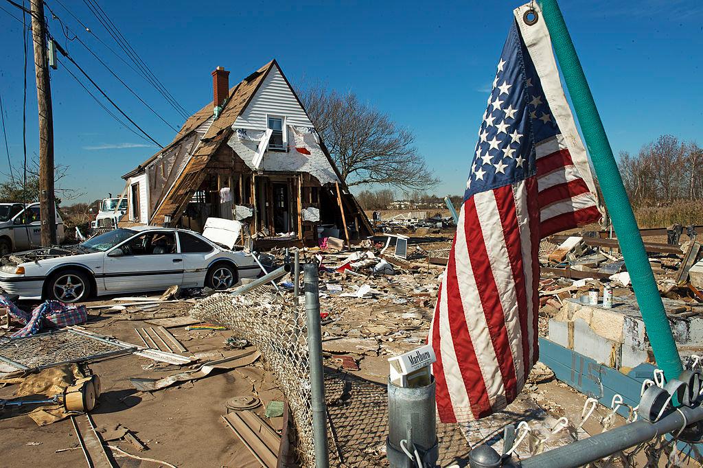 A house at 121 Kissam Ave is seen with its entire first floor washed away, as well as the entire surrounding area demolished when Hurricane Sandy hit the coastal estuary in the Oakwood Beach area of Staten Island, New York on Nov. 6, 2012. (PAUL J. RICHARDS/AFP/Getty Images)