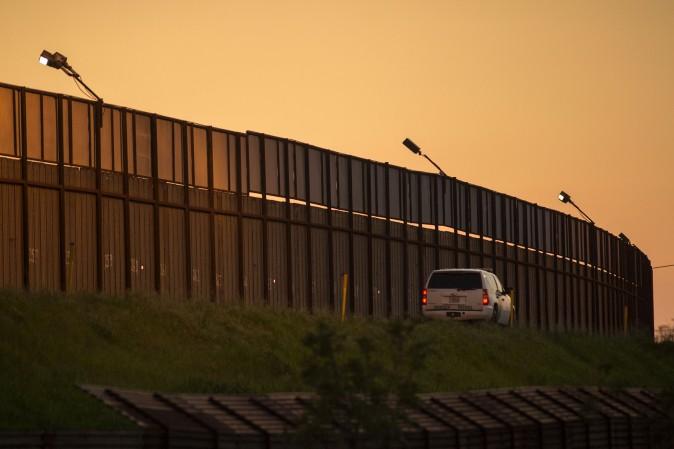A border patrol agent drives along the US- Mexico border crossing on January 26, 2017 in San Ysidro, California. (David McNew/AFP/Getty Images)
