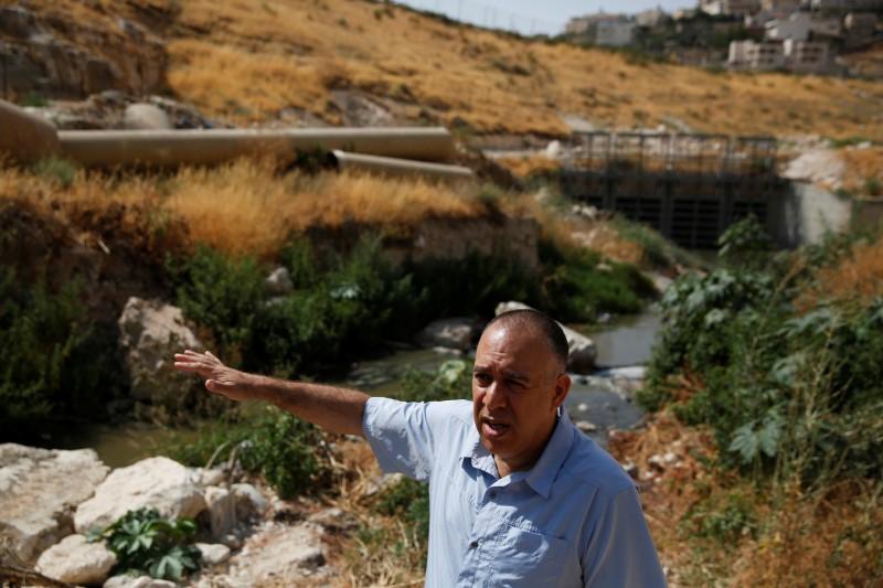 Shony Goldberger, director of the Jerusalem district in Israel's Environmental Protection Ministry speaks during an interview with Reuters as sewage flows in the Kidron Valley, on the outskirts of Jerusalem July 6, 2017. (REUTERS/Ronen Zvulun)