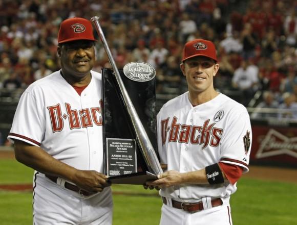 Arizona Diamondbacks' Aaron Hill (R) is presented the Silver Slugger Award by hitting coach Don Baylor before the start of their MLB Opening Day National League baseball game against the St. Louis Cardinals in Phoenix, Arizona on April 1, 2013. (Ralph D. Freso/REUTERS)