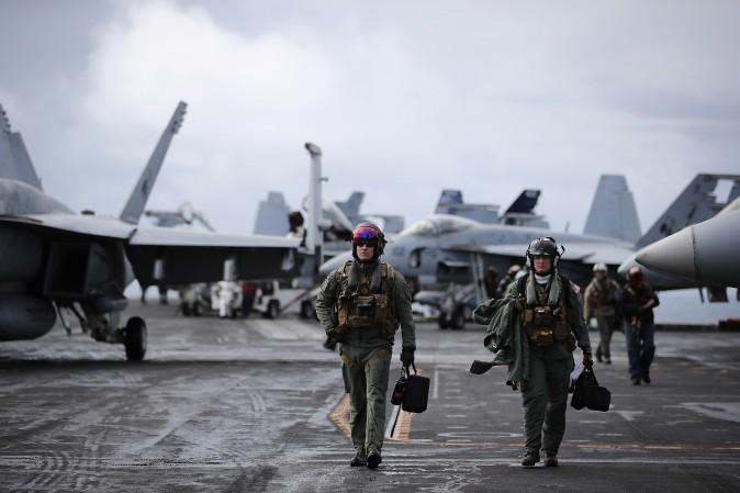 F/A-18 Hornet pilots return from a flight during joint military exercise, Saxon Warrior, aboard the USS George H.W. Bush off the north west coast of the United Kingdom on Aug. 6, 2017. (Dan Kitwood/Getty Images)