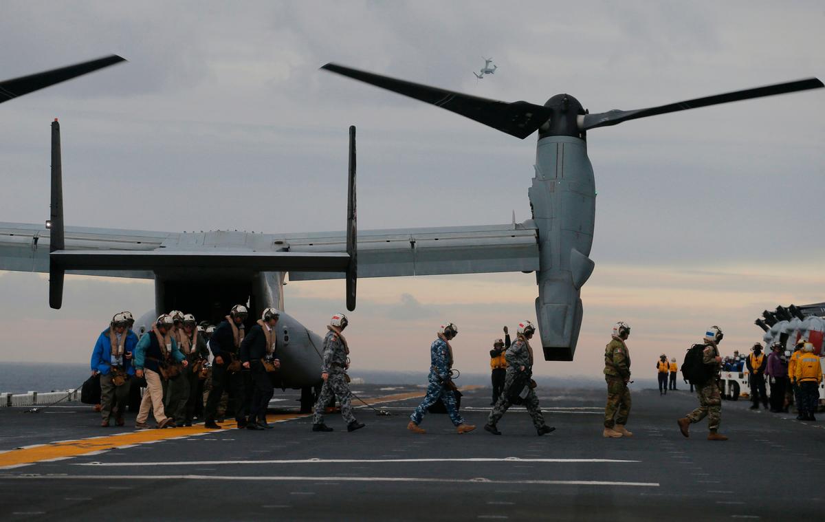 Participants in a ceremony marking the start of Talisman Saber 2017, a biennial joint military exercise between the United States and Australia, arrive on a US Marines MV-22B Osprey Aircraft on the deck of the USS Bonhomme Richard amphibious assault ship off the coast of Sydney on June 29, 2017. (JASON REED/AFP/Getty Images)