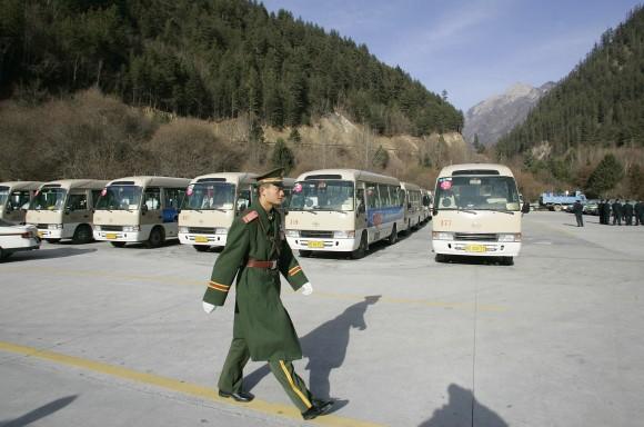 File: A Chinese paramilitary soldier inspects parking area at Jiuzhaigou Nine-village valley) in the Aba Tibetan and Qiang Autonomous Prefecture in China's southwestern province of Sichuan, Jan. 9, 2006. (LIU JIN/AFP/Getty Images)