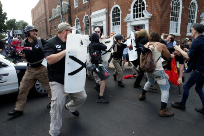 Members of white nationalists clash a group of counter-protesters in Charlottesville, Virginia, U.S., August 12, 2017. REUTERS/Joshua Roberts
