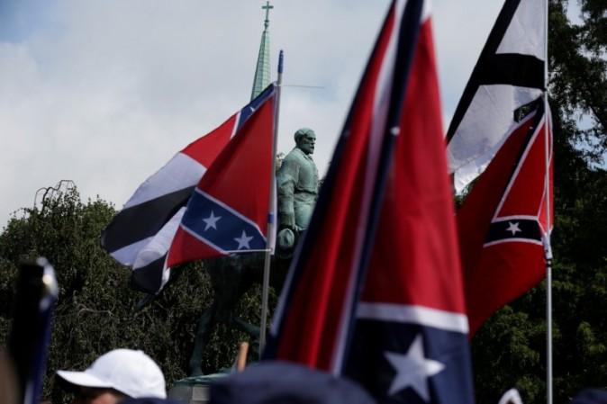 Members of white nationalists rally around a statue of Robert E. Lee in Charlottesville, Virginia, U.S., August 12, 2017. REUTERS/Joshua Roberts