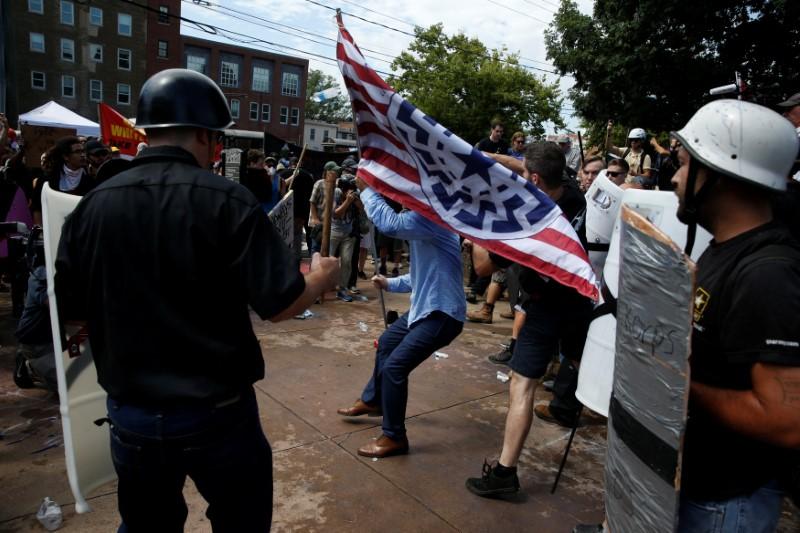 Members of white nationalist protesters are attacked by a group of counter-protesters in Charlottesville, Virginia, U.S., August 12, 2017. (REUTERS/Joshua Roberts)