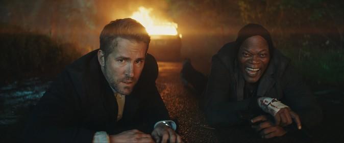 (L–R) Michael Bryce (Ryan Reynolds) and Darius Kincaid (Samuel L. Jackson) as a violent odd couple, in "The Hitman's Bodyguard." (Summit Entertainment and Millennium Media)