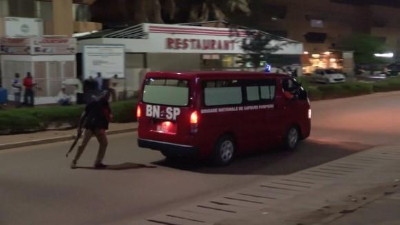 A fire brigade vehice departs following an attack by gunmen on a restaurant in Ouagadougou, Burkina Faso, in this still frame taken from video August 13, 2017. (REUTERS/Reuters TV)
