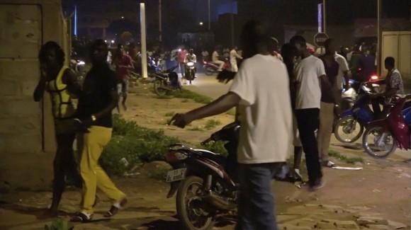 Restaurant customers run in the street following an attack by gunmen on a restaurant in Ouagadougou, Burkina Faso, in this still frame taken from video August 13, 2017. (REUTERS/Reuters TV)