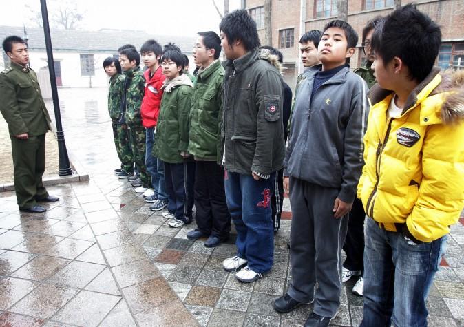 Some 20-odd teenagers assemble at the Internet Addiction Treatment Centre in the southeastern suburb of Daxing in Beijing, on March 1, 2007, all placed there involuntarily by their families, to go through a strict regimen that might as well be boot camp. (AFP/AFP/Getty Images)