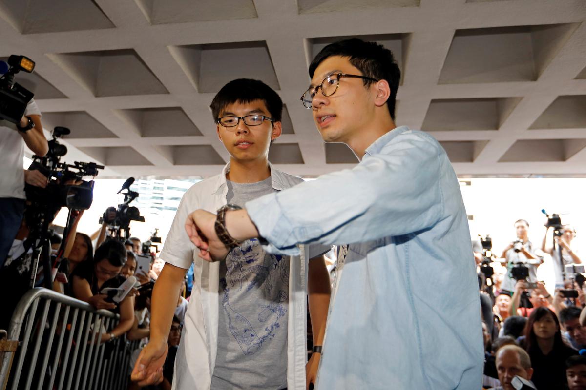 Student leaders Joshua Wong and Nathan Law arrive at the High Court to face verdict on charges relating to the 2014 pro-democracy Umbrella Movement, also known as Occupy Central protests, in Hong Kong, China on August 17, 2017. (REUTERS/Tyrone Siu)