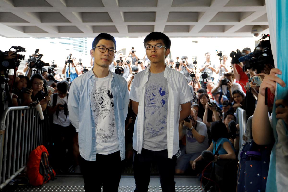 Student leaders Nathan Law and Joshua Wong arrive at the High Court to face verdict on charges relating to the 2014 pro-democracy Umbrella Movement, also known as Occupy Central protests, in Hong Kong, China on August 17, 2017. (REUTERS/Tyrone Siu)