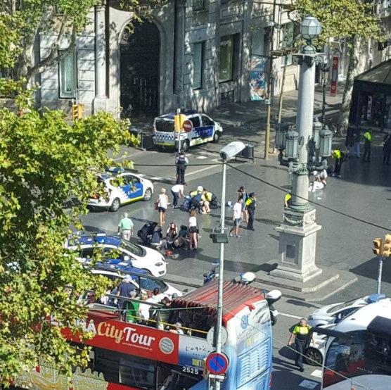Police and emergency services attend to injured persons at the scene after a van crashed into pedestrians near the Las Ramblas avenue in central Barcelona, Spain on Aug.17, 2017, in this still image from a video obtained from social media. (Courtesy of @Vil_Music/via REUTERS)