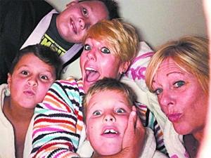 Amy Blazitz (R) with her daughter and three grandsons, during a recent family evening at home in Gahanna, Ohio. (COURTESY OF AMY BLAZITZ)