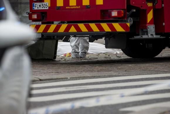 Rescue personnel have covered a stabbing victim's body at the Turku Market Square in the Finnish city of Turku where several people were stabbed on August 18, 2017.<br/>One person was killed and eight were injured in a stabbing spree in the Finnish city of Turku, a hospital director said, after police shot one suspect and warned several others could be at large. (RONI LEHTI/AFP/Getty Images)