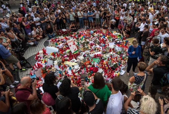 People gather around tributes laid on Las Ramblas near the scene of the Aug. 17 terrorist attack in Barcelona, Spain. (Carl Court/Getty Images)