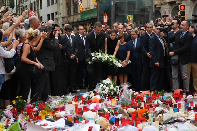 Spain's King Felipe VI and Queen Letizia stand at a memorial for the victims of the Barcelona attack on Las Ramblas boulevard in Barcelona on Aug. 19, 2017, two days after a van ploughed into the crowd, killing 13 persons and injuring over 100. (LLUIS GENE/AFP/Getty Images)