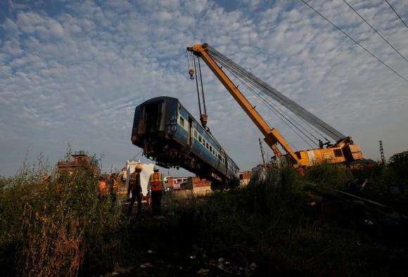 A damaged coach of a passenger train is removed from the site of an accident in Khatauli, in the northern state of Uttar Pradesh, India August 20, 2017. (Reuters/Adnan Abidi)