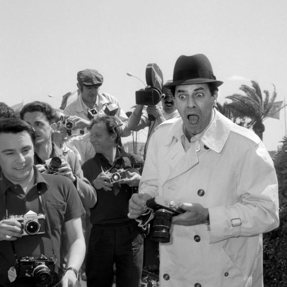 U.S. comedian, director, and singer Jerry Lewis jokes with photographers on Sept. 23, 1965, upon his arrival at the International Cannes Film Festival. (STF/AFP/Getty Images)