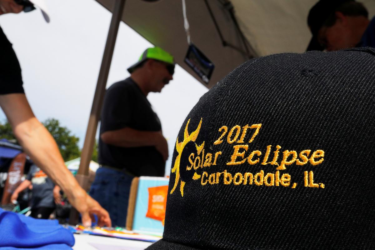 The Rotary Club sells commemorative baseball caps in Carbondale, Illinois, U.S., August 20, 2017, one day before the total solar eclipse. (REUTERS/Brian Snyder)
