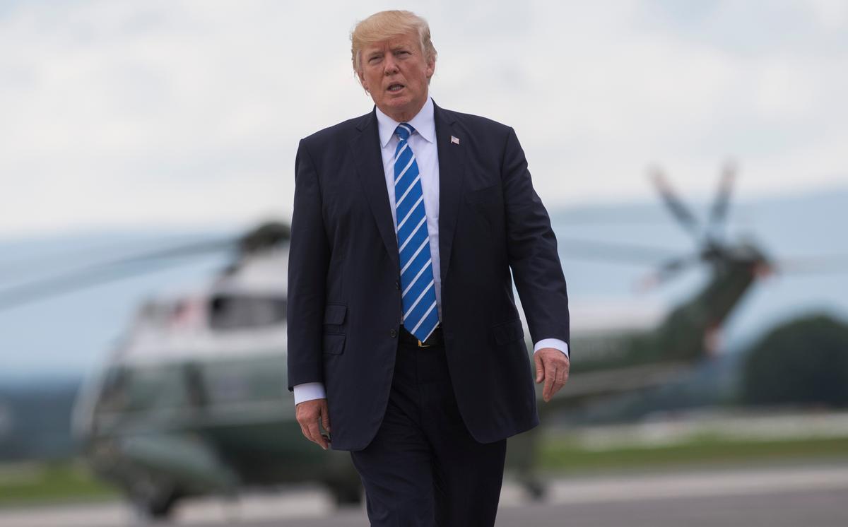 President Donald Trump walks from Marine One to board Air Force One prior to departing from Hagerstown Regional Airport following meetings at Camp David and before returning to Bedminster, New Jersey, on Aug. 18. (SAUL LOEB/AFP/Getty Images)