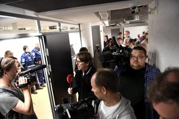 Press and and police pictured before the initial remand hearing of Abderrahman Mechkah (lying in a hospital bed, attending the court session via video), 18 year-old Moroccan man is held at Southwest Finland District Court in Turku, Finland, August 22, 2017. (Lehtikuva/Martti Kainulainen via Reuters)