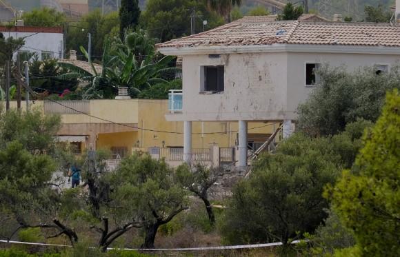 FILE PHOTO: A building with shattered windows is seen next to the site where a house, which Barcelona attackers used to prepare the attacks, collapsed on Wednesday in Alcanar near Taragona, Spain, August 20, 2017. (Reuters/Heino Kalis/File Photo)