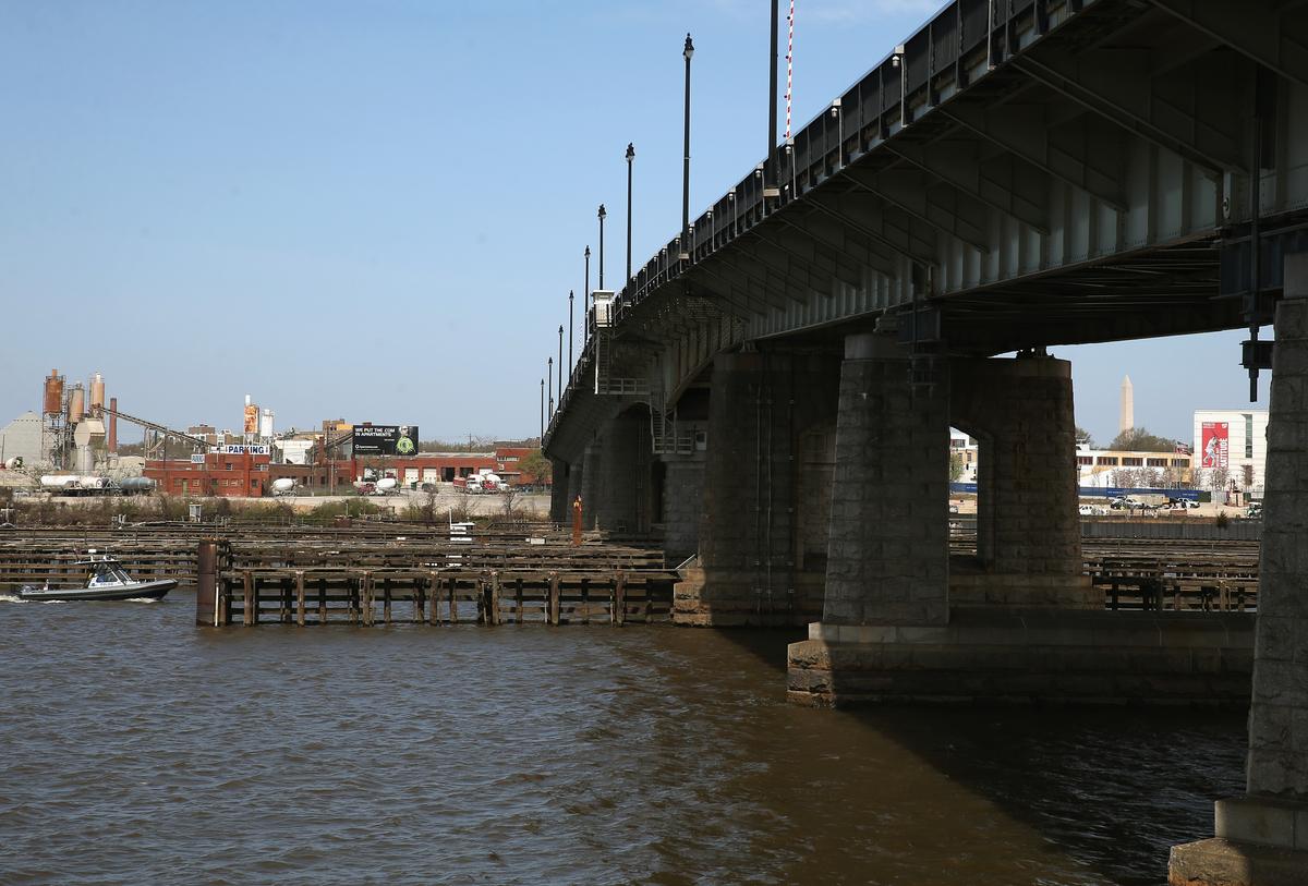 A boat passes under the Frederick Douglass Memorial Bridge also known as the South Capitol Street bridge is seen in Washington on April 13, 2015. (Mark Wilson/Getty Images)