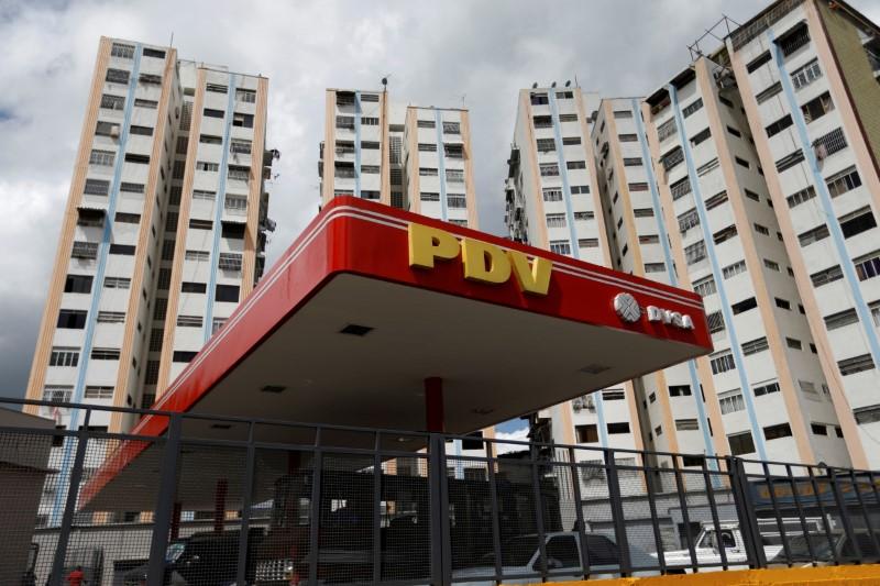 A PDVSA gas station is seen next to building apartments in Caracas, Venezuela on July 25, 2017. (REUTERS/Andres Martinez Casares/File Photo)