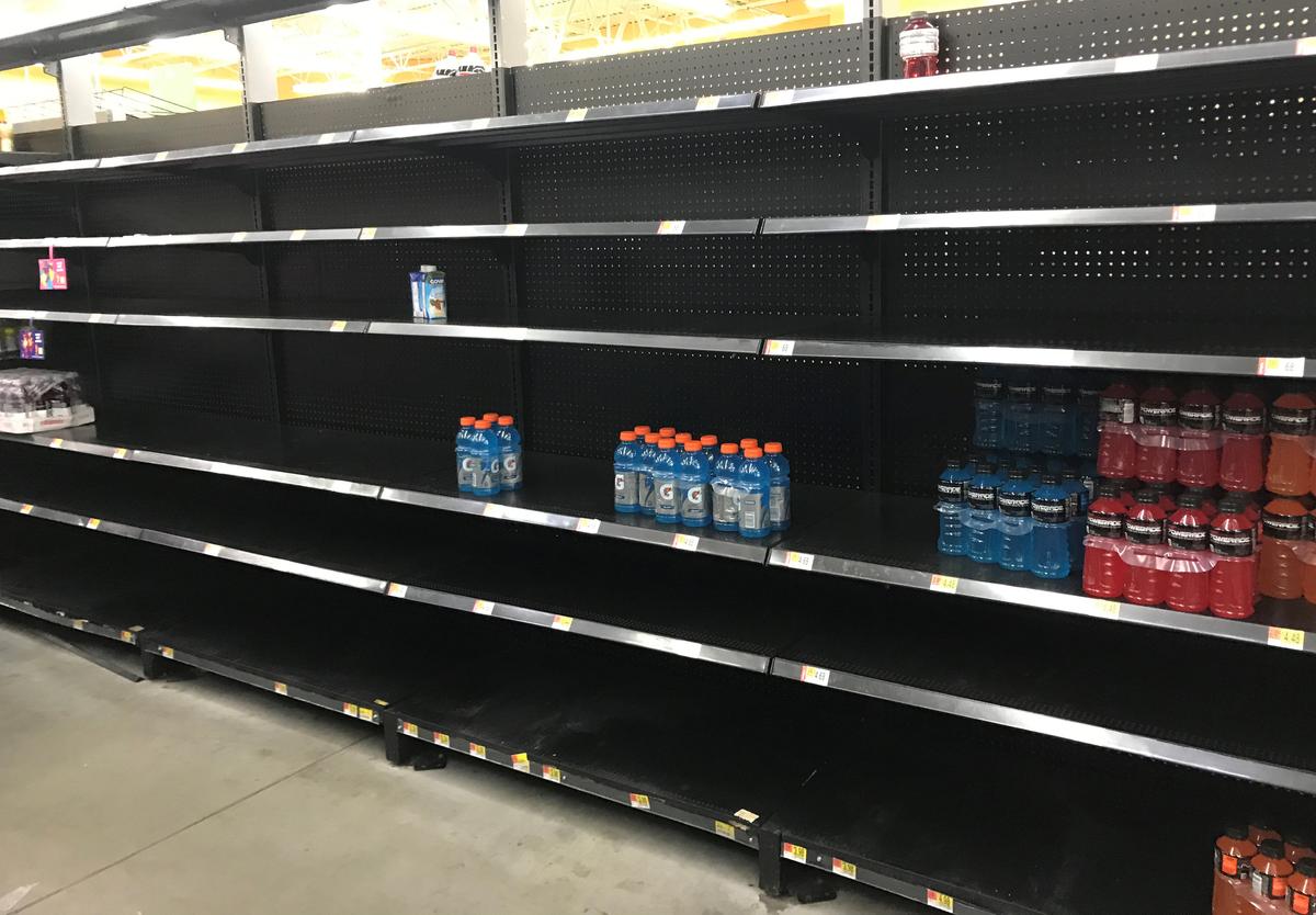 Shelves sit nearly empty in a Walmart store as residents stock ahead of Hurricane Harvey approaching landfall near the Texas coastal area, in Houston, Texas on Aug. 25, 2017. (REUTERS/Ernest Scheyder)