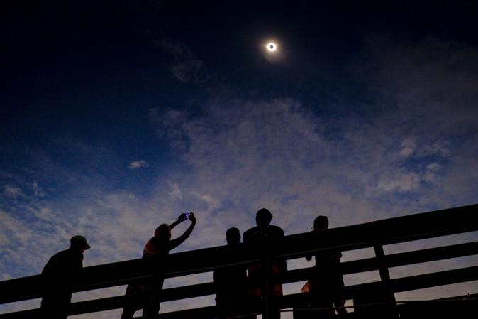 Solar eclipse watchers were ecstatic as the clouds broke minutes before totality during the total solar eclipse. One of the last vantage points where totality was visible on Aug. 21, 2017, in Isle of Palms, S.C. (Pete Marovich/Getty Images)