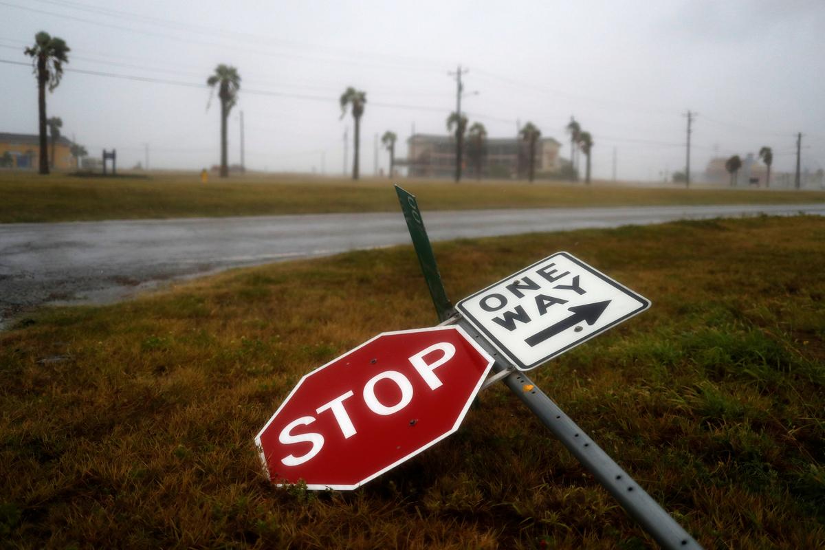 Street signs lie on the ground after winds from Hurricane Harvey escalated in Corpus Christi, Texas on Aug. 25, 2017. (REUTERS/Adrees Latif)