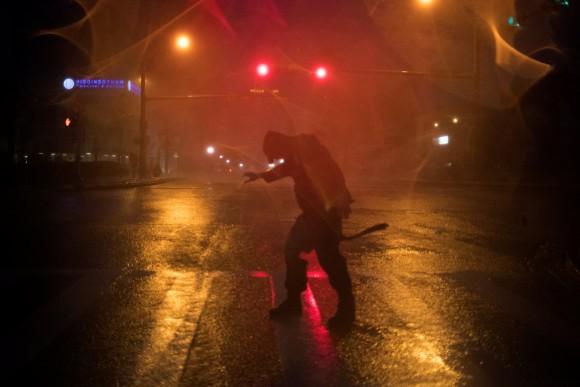 Stewart Adams, of San Marcos, Texas, plays in the winds from Hurricane Harvey in Corpus Christi, Texas, U.S. August 25, 2017. (Reuters/Adrees Latif)