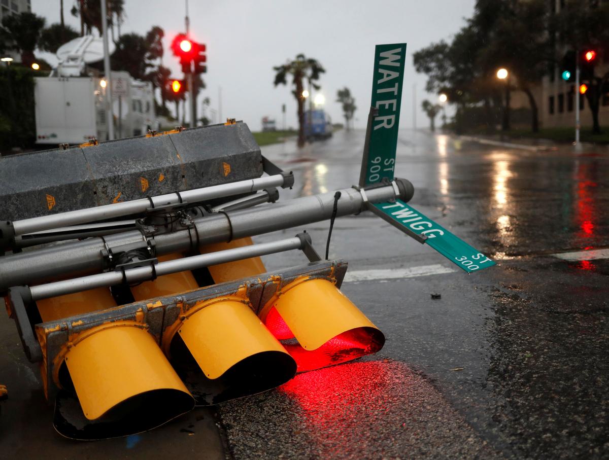Traffic lights lie on a street after being knocked down, as Hurricane Harvey approaches in Corpus Christi, Texas. (REUTERS/Adrees Latif)